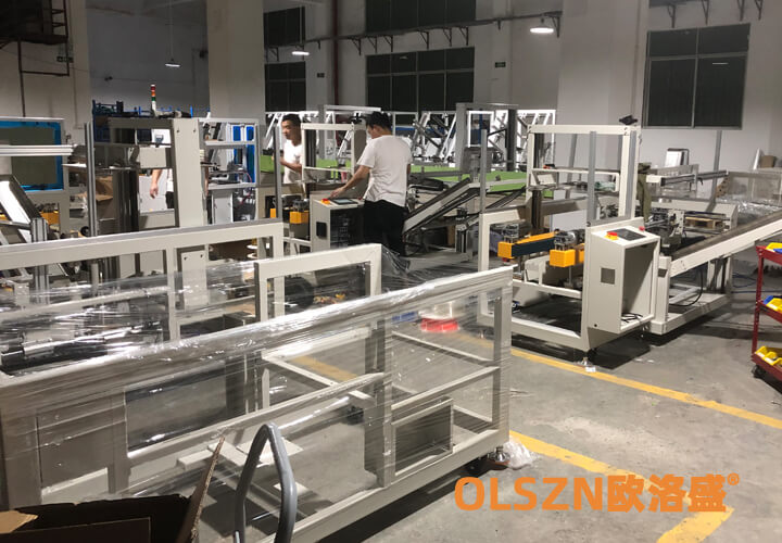 歐洛盛開(kāi)箱機(jī),裝箱機(jī),折盒機(jī)生產(chǎn)車(chē)間